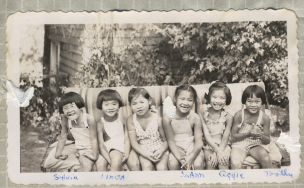 photo of kids smiling in black and white